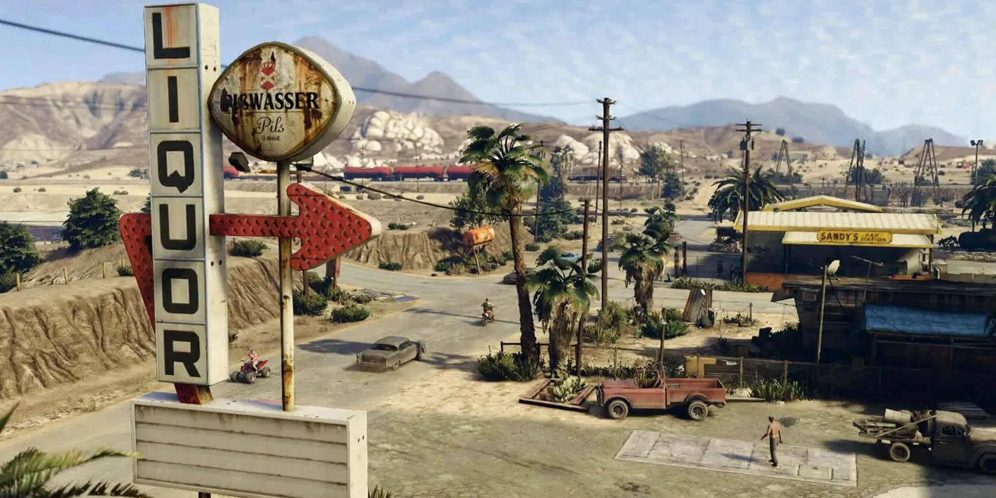 Khung cảnh thị trấn Sandy Shores hoang vắng trong GTA 5 với núi Chiliad ở phía xa