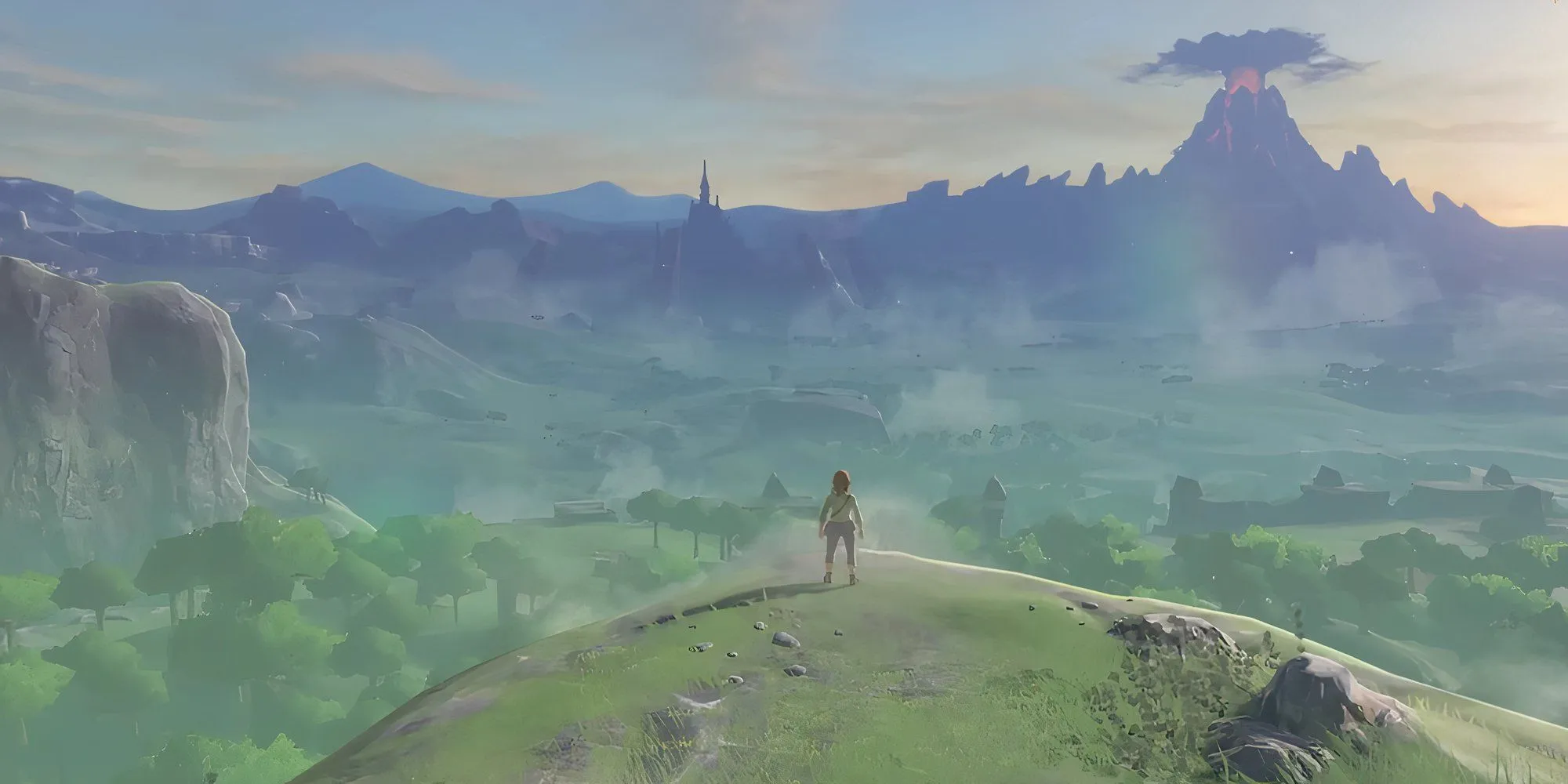 Link trong The Legend of Zelda Breath Of The Wild đứng trên vách đá nhìn ra thế giới Hyrule rộng lớn