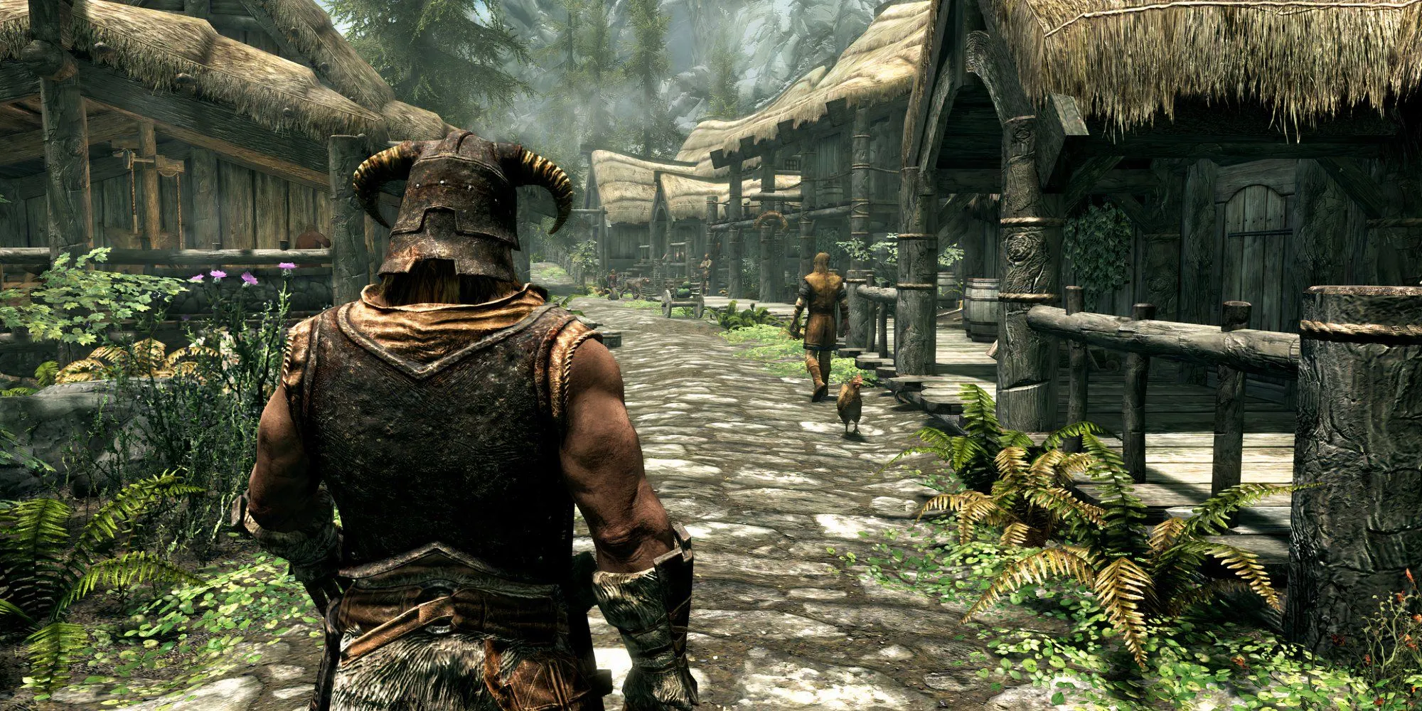 Nhân vật chính Dragonborn trong The Elder Scrolls V: Skyrim nhìn ra xa từ một ngôi làng cổ kính