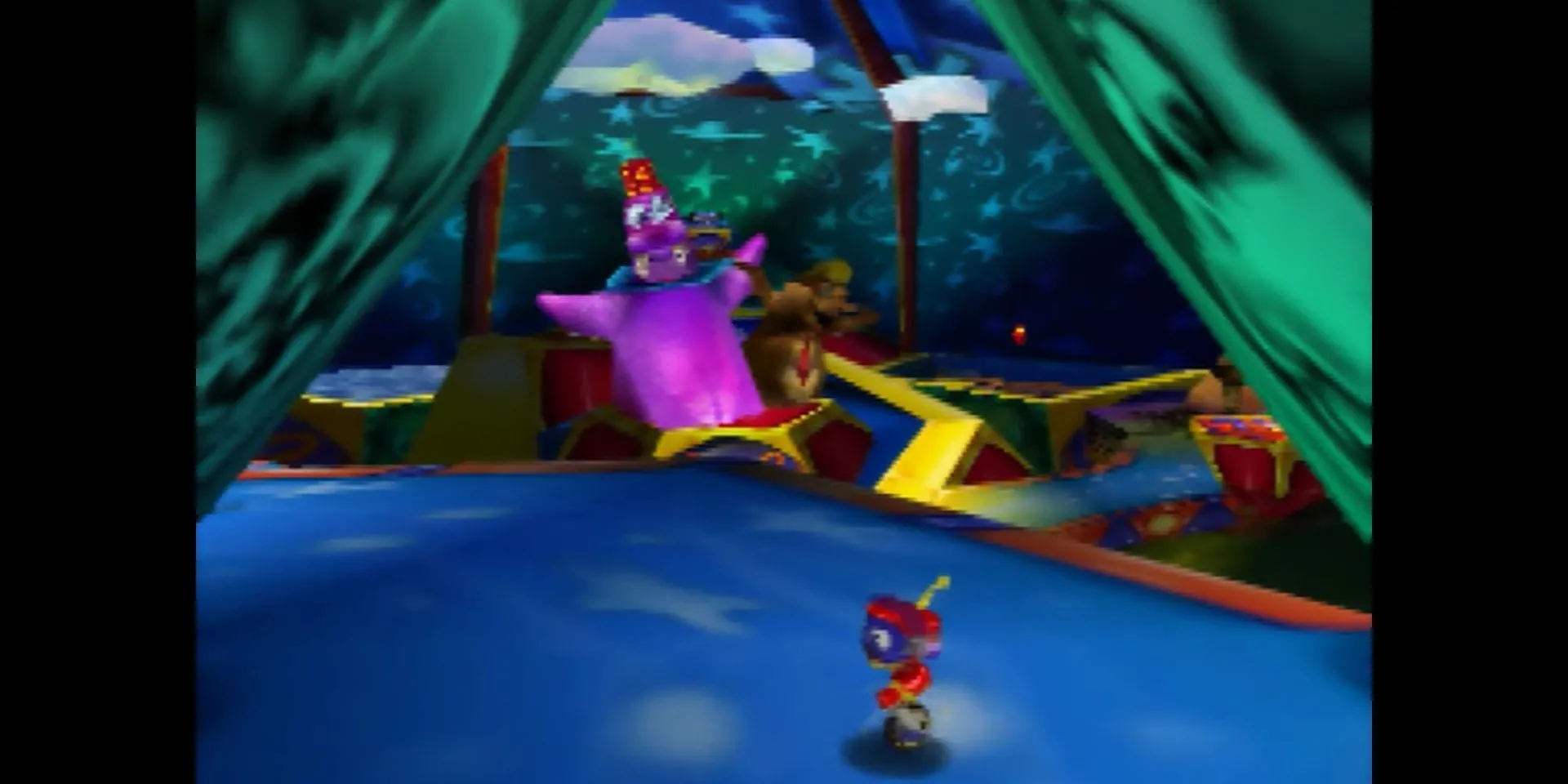 Robot Rocket đứng trước cổng vào Whoopie World trong Rocket: Robot on Wheels N64