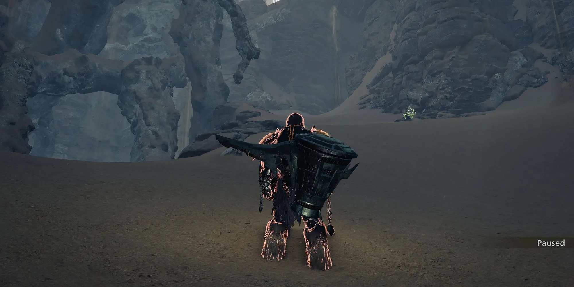Thợ săn khám phá hang động tối tăm để tìm Ancient Wyvern Coin trong Monster Hunter Wilds
