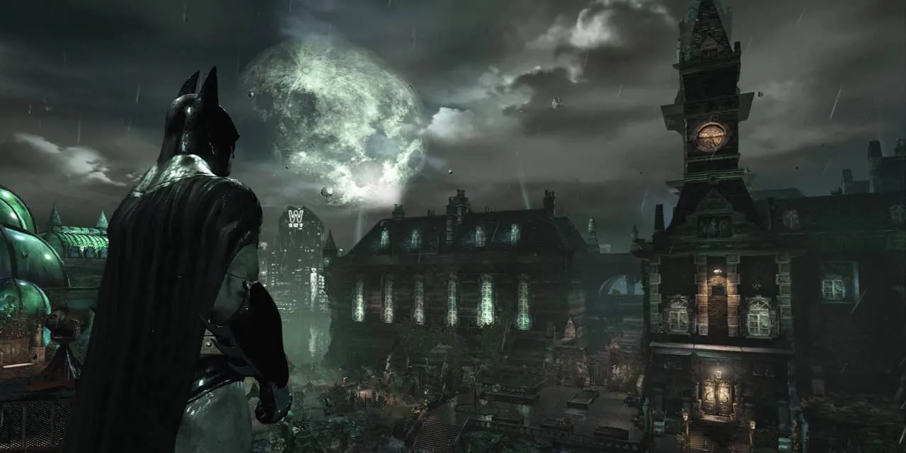 Batman đứng trên cao nhìn xuống trại thương điên Arkham Asylum vào ban đêm