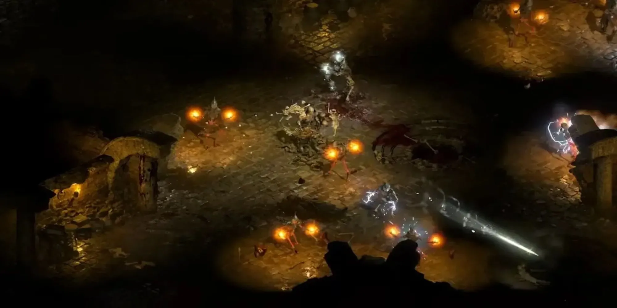 Diablo 2 Resurrected với một nhóm nhân vật chiến đấu trong cảnh địa ngục đầy máu và lửa