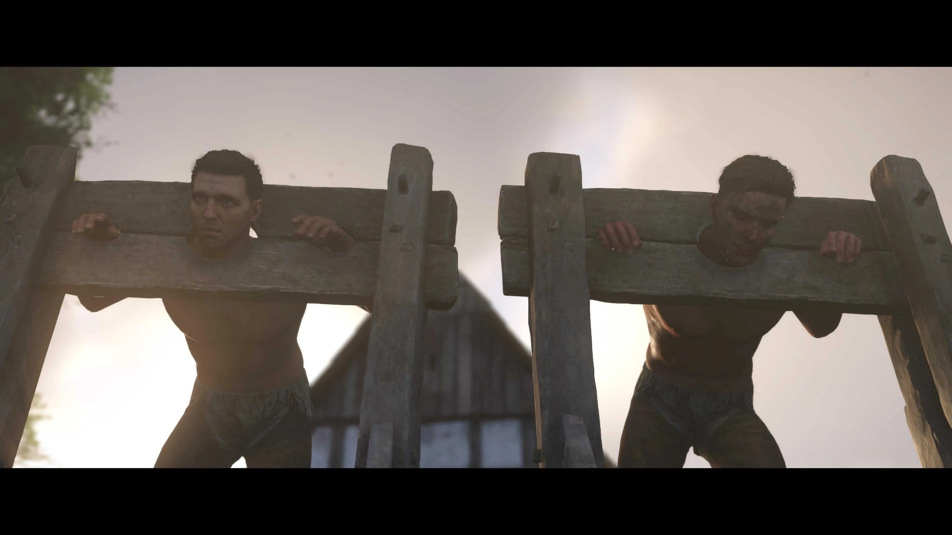 Hans và Henry bị nhốt vào cùm gỗ trong Kingdom Come Deliverance 2