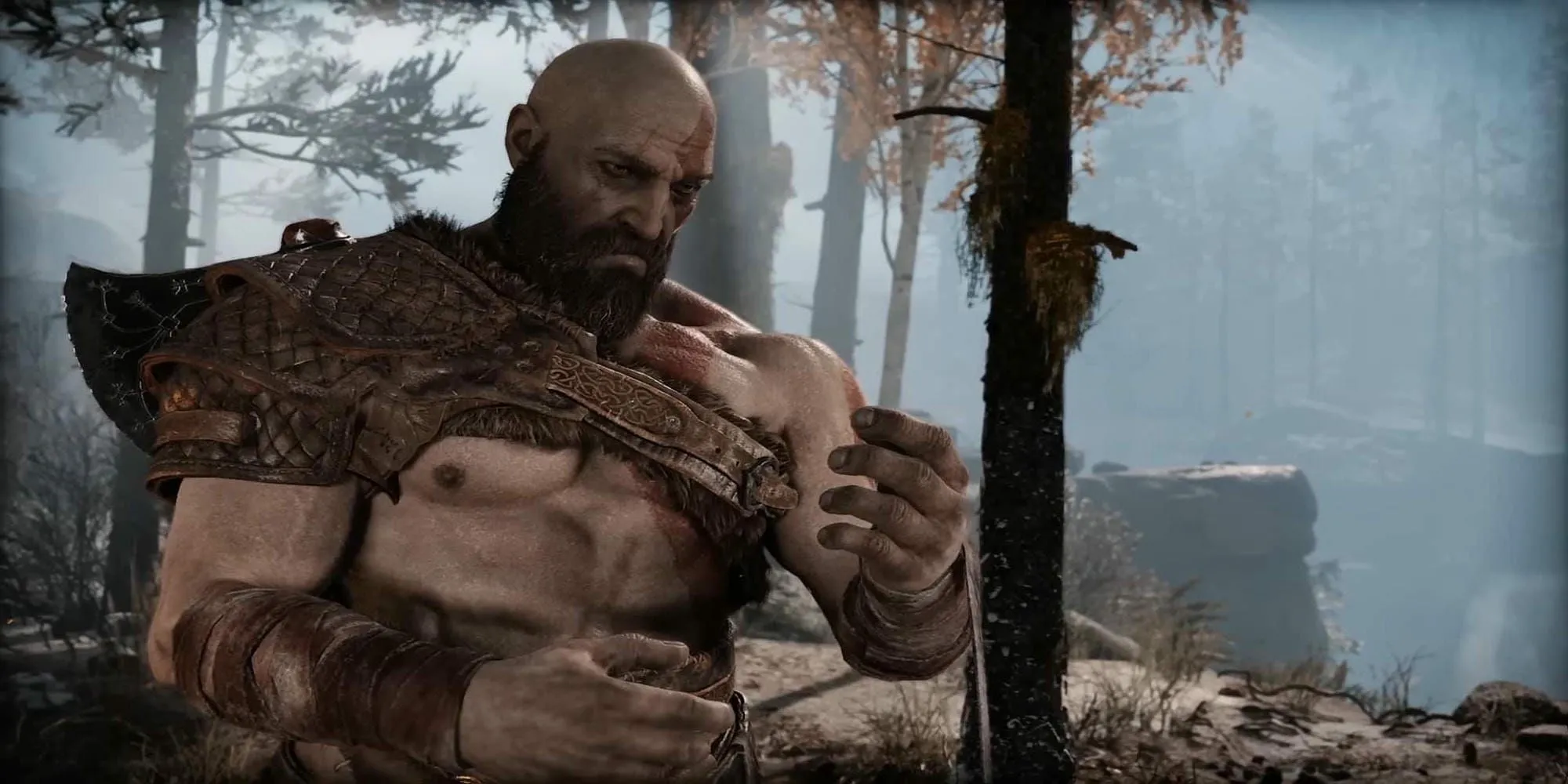 Kratos với biểu cảm trầm tư trong game hành động phiêu lưu God of War (2018)