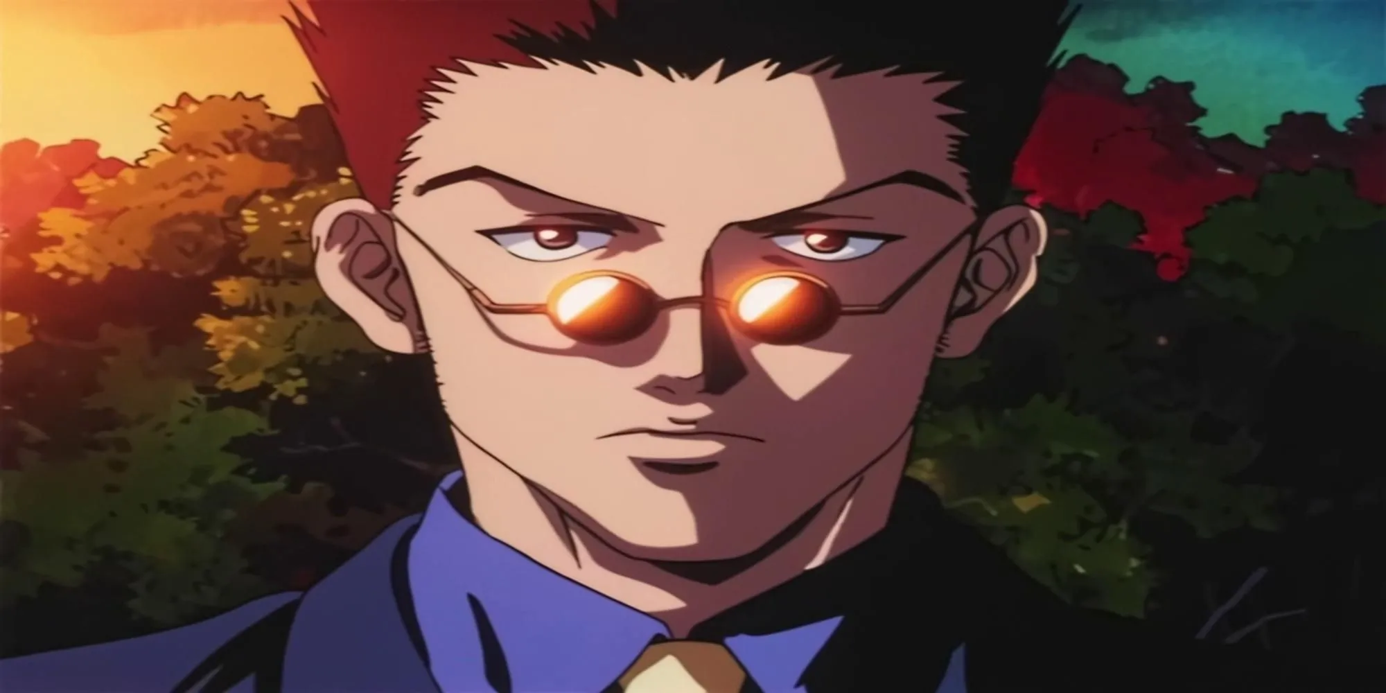 Leorio Paradinight từ Hunter x Hunter, trông như một người đàn ông trưởng thành trong bộ vest nhưng chỉ 19 tuổi.