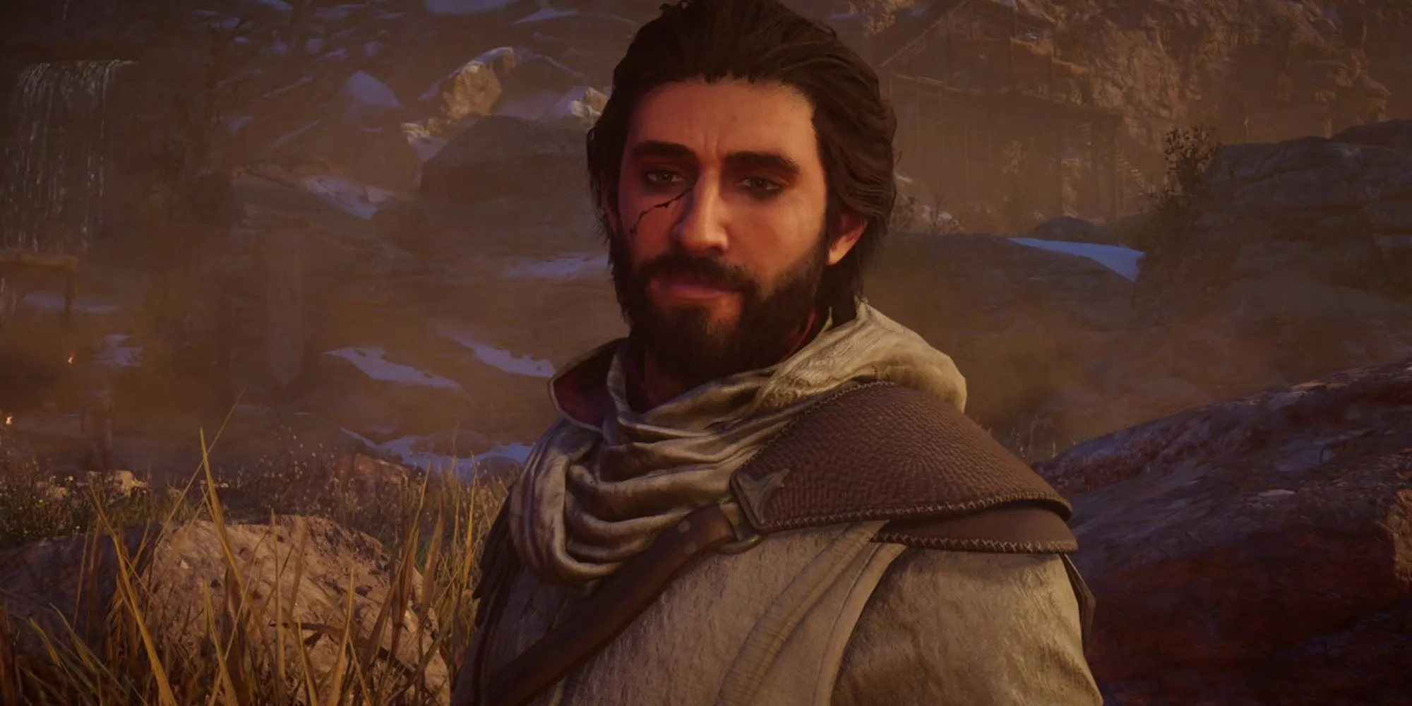 Still of Basim standing in the wilderness with a scratch on his face in Assassin