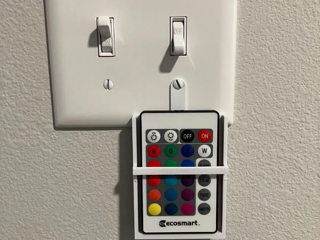 Giữ điều khiển LED gắn trên cover công tắc, tiện cho góc chơi game