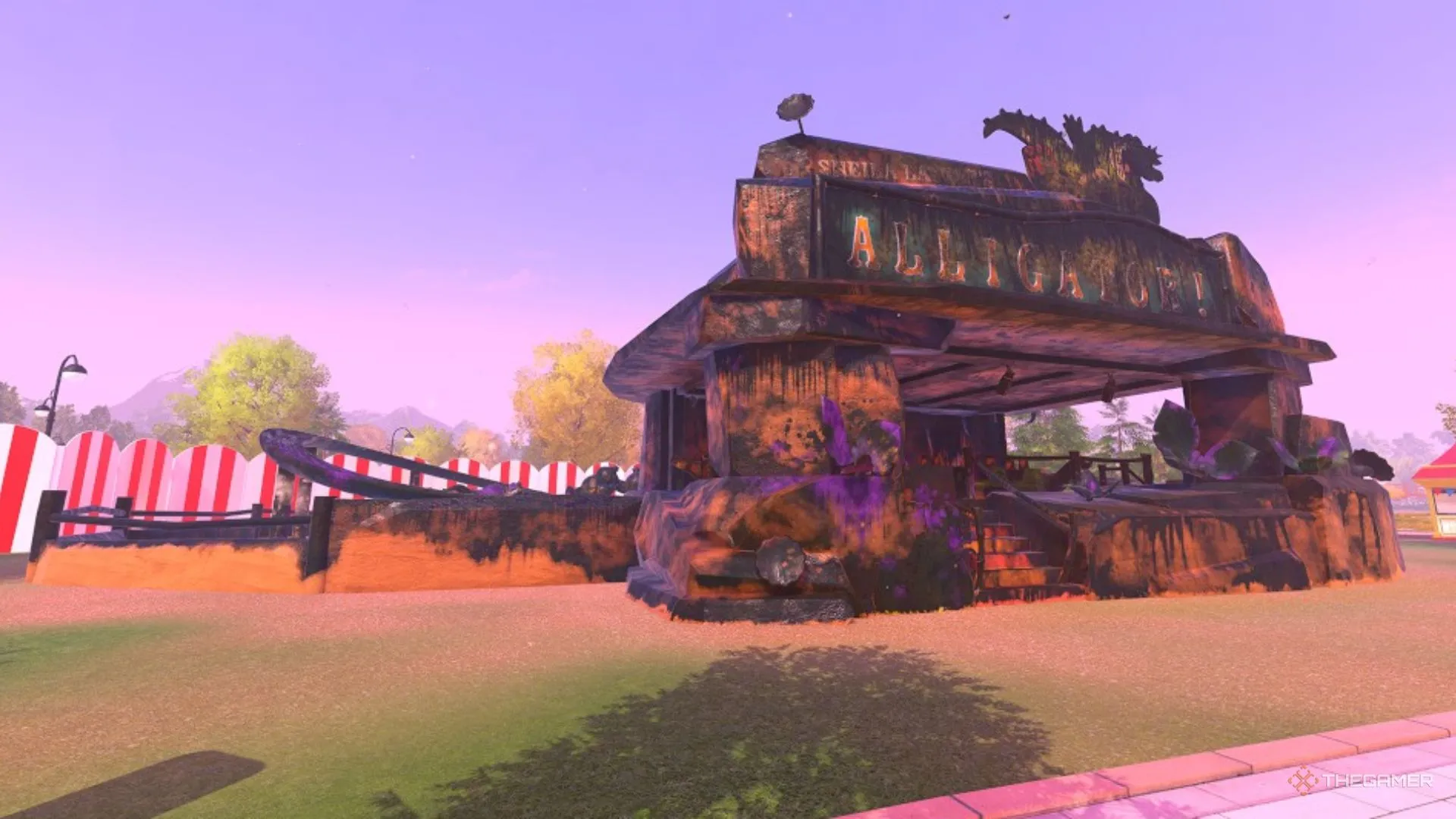 Một đường tàu lượn chủ đề cá sấu phủ bùn và rêu trong PowerWash Simulator 2.